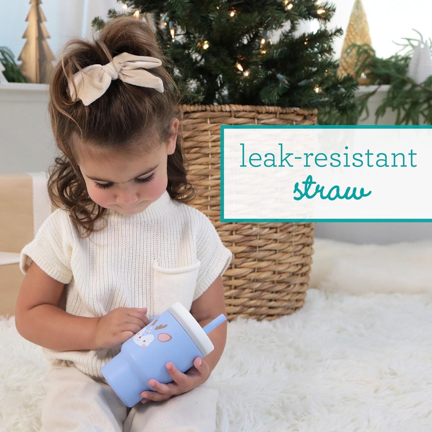 Image displaying a baby with a tumbler and it's details