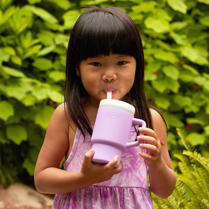 Image displaying a kid drinking from a kid's tumbler