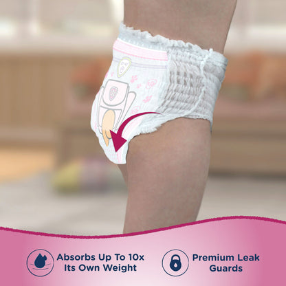 Child wearing a training pant with features like high absorption and premium leak guards