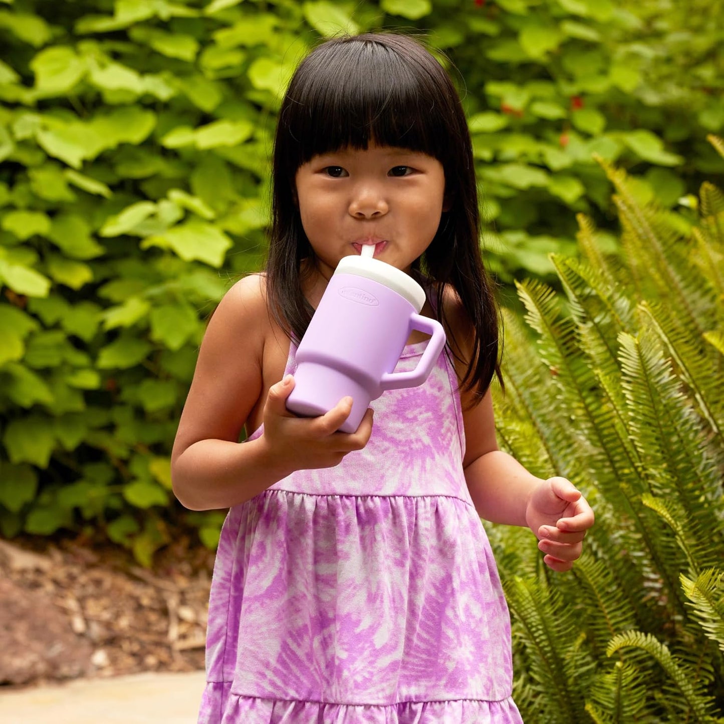 Image displaying a kid drinking from a kid's tumbler