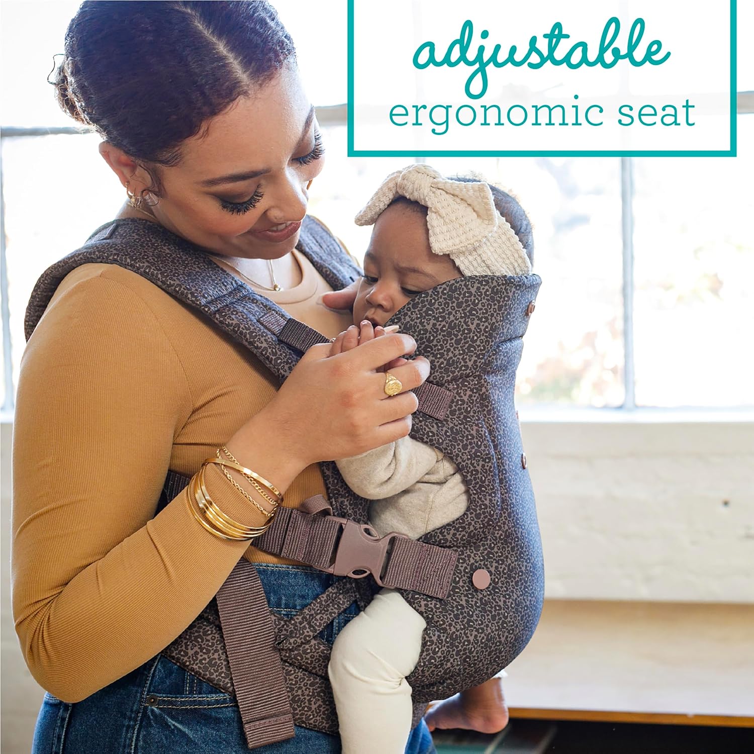 Image displaying a baby in a baby carrier and text about it's deetalis 