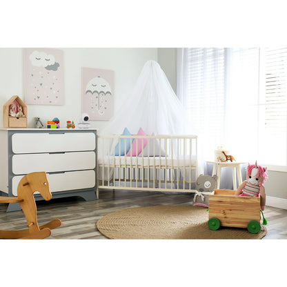 A shelf in a child's room with toys, decorations, and a baby monitor