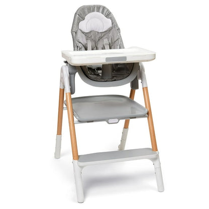 Baby high chair with gray cushion and wooden legs on a white background