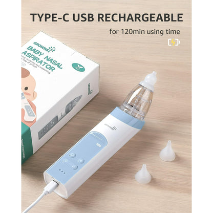 Baby nasal aspirator with USB cable and packaging on a wooden surface
