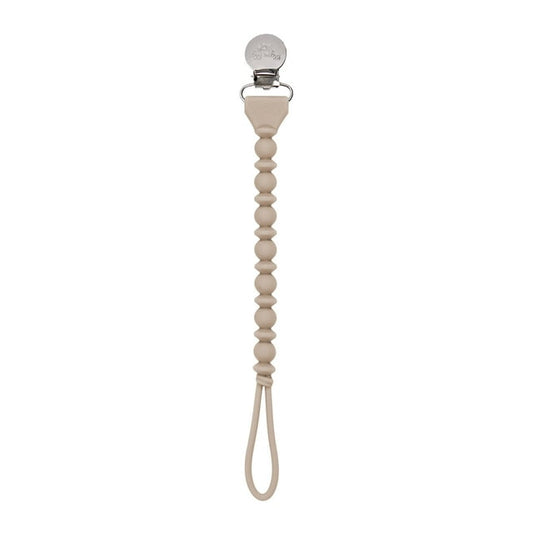 Beige pacifier clip with a beaded design on a white background