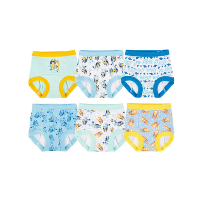 Six pairs of colorful, patterned toddler training pants are arranged on a white background