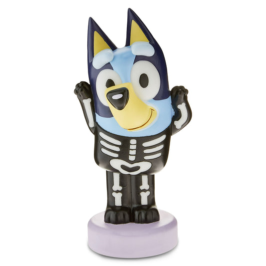 Cartoon character figurine wearing a skeleton costume on a white background