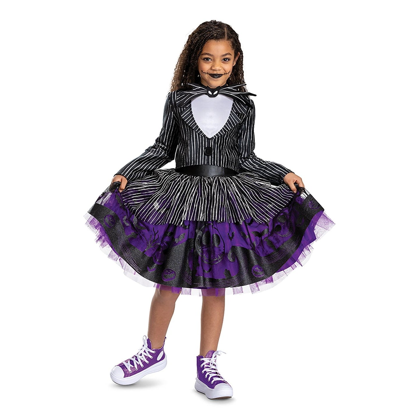 Child wearing a black and purple Halloween costume with a white background