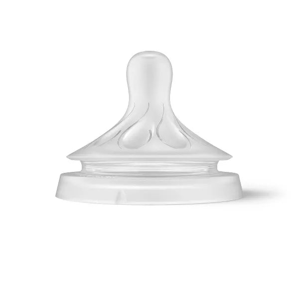 Clear baby bottle nipple on a white background