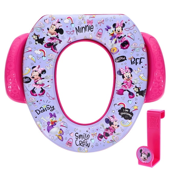 A purple and pink child's toilet training seat featuring cartoon characters, with a matching pink hook