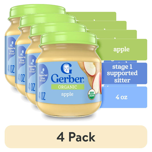 Four jars of Organic baby food with green lids on a white background