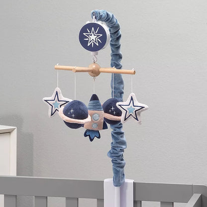 Musical baby crib mobile with hanging rocket, planets, and stars above a crib