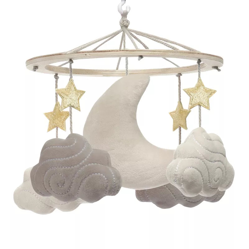 A baby crib mobile featuring a moon, stars, and clouds hanging from a wooden ring