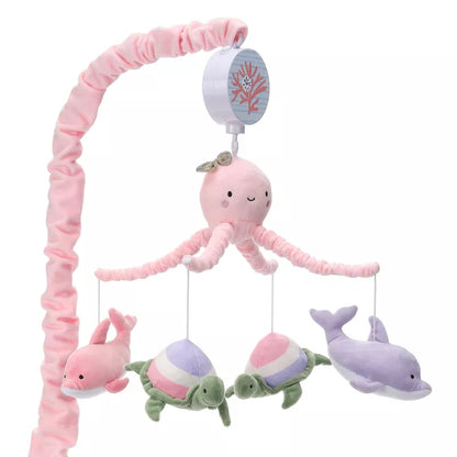 A baby crib mobile featuring a pink octopus, two dolphins, and two striped turtles