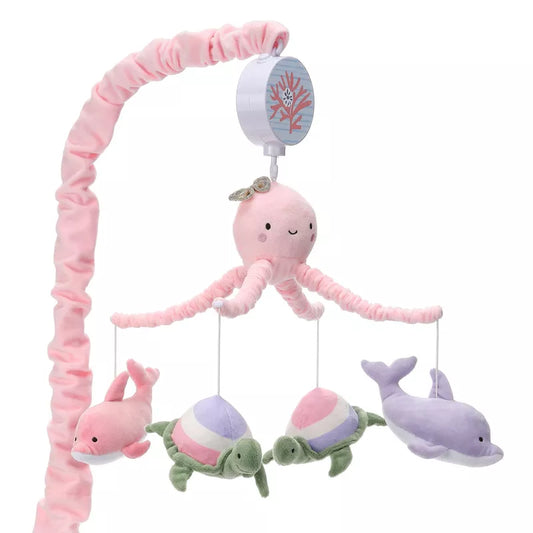 A baby crib mobile featuring a pink octopus, two dolphins, and two striped turtles