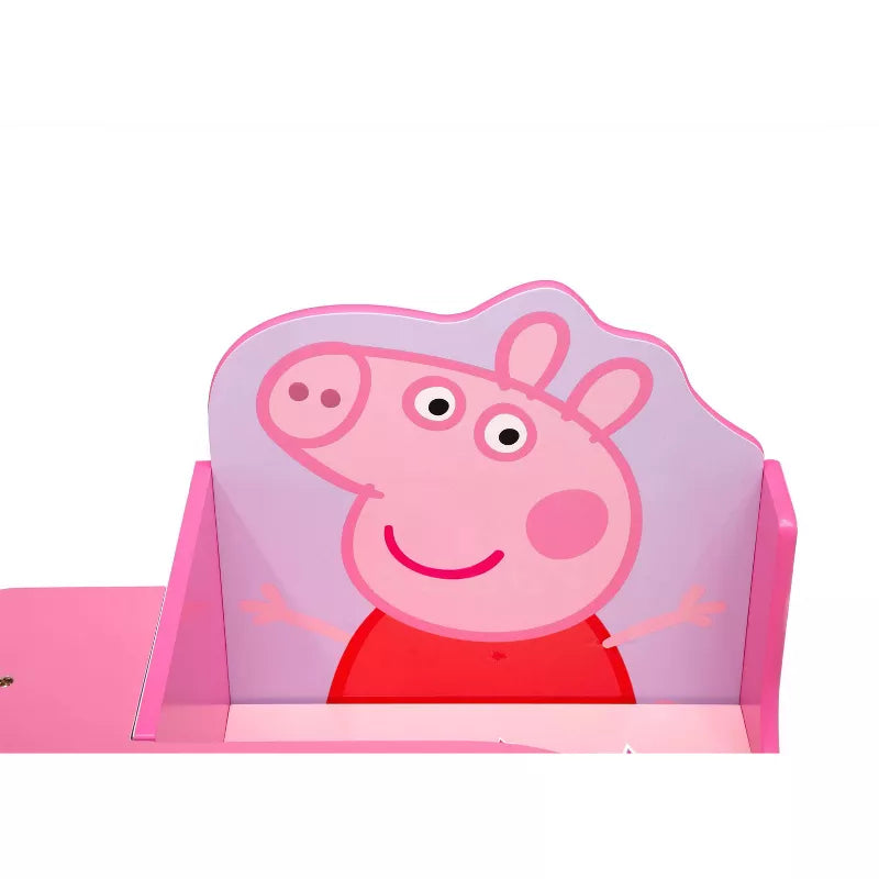 A pink child's chair desk with a cartoon character on the backrest