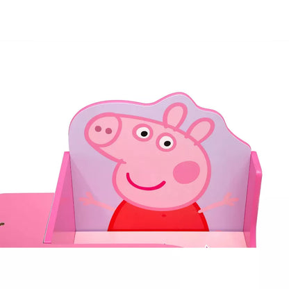 A pink child's chair desk with a cartoon character on the backrest