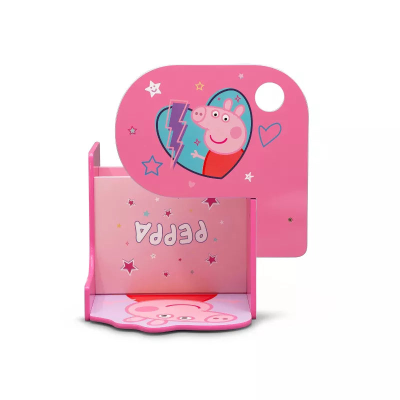 A pink child's chair desk with a storage bin, featuring a pig character and star decorations