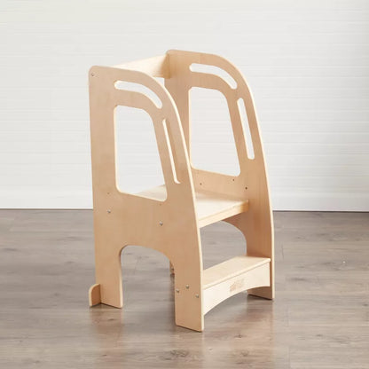 A wooden learning tower or kitchen helper stool for children