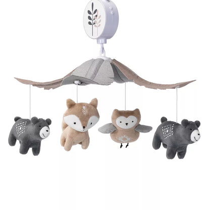 A baby crib musical mobile with hanging plush forest animals, including bears, a fox, and an owl