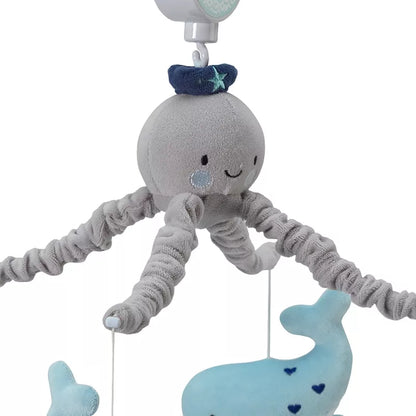 A musical baby crib mobile featuring a plush octopus and a whal
