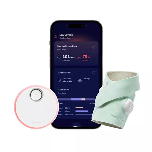 Wearable baby monitor with fabric band and sensor next to a smartphone showing sleep, pulse, and oxygen readings