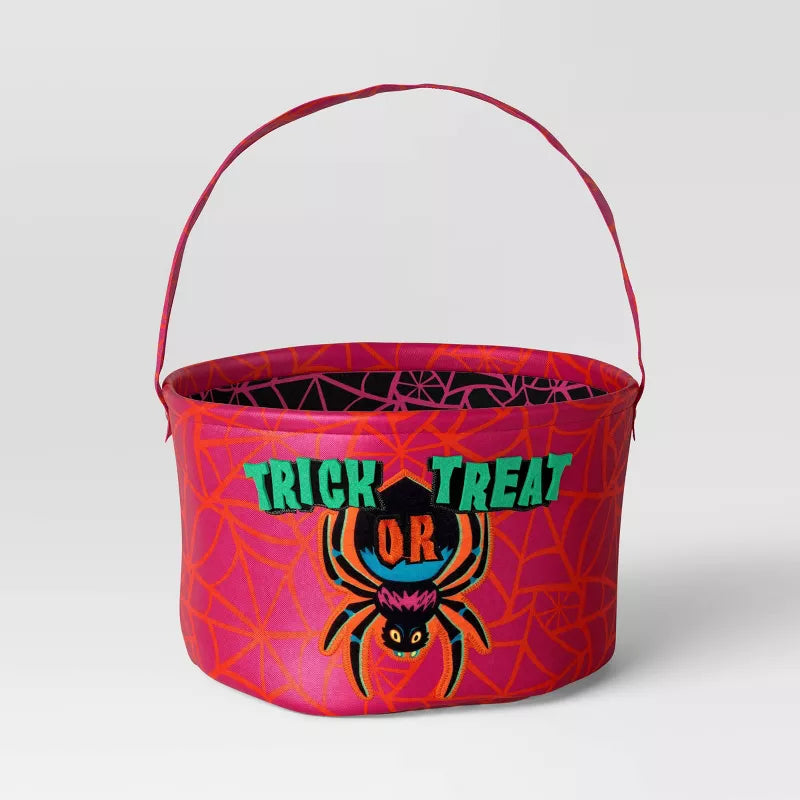 Halloween-themed candy bucket with spider design and 'Trick or Treat' text on a white background