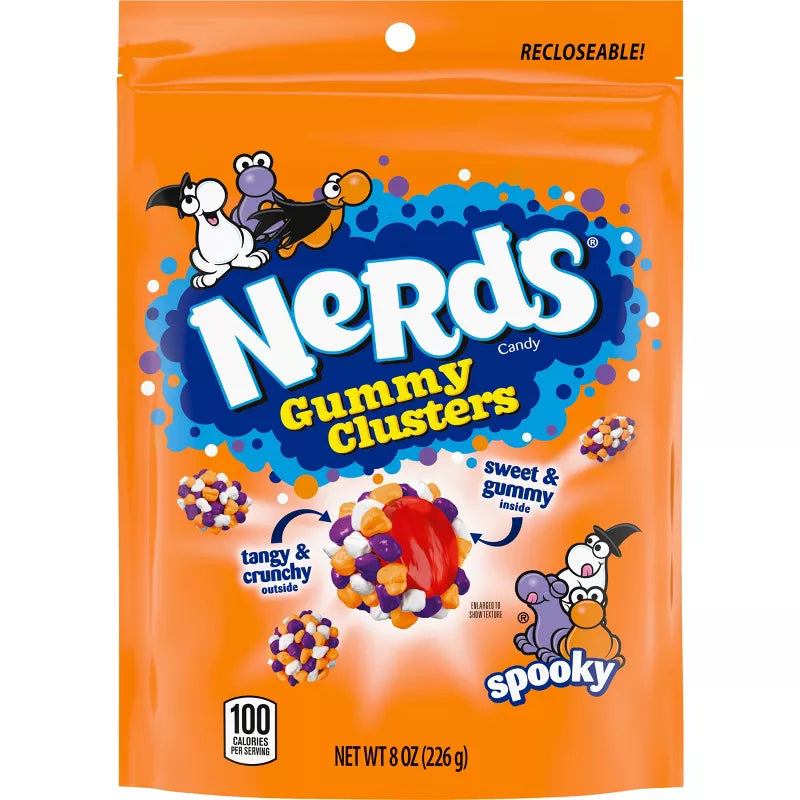 Halloween themed candy, Orange packaging with Gummy Clusters with cartoon characters on a white background