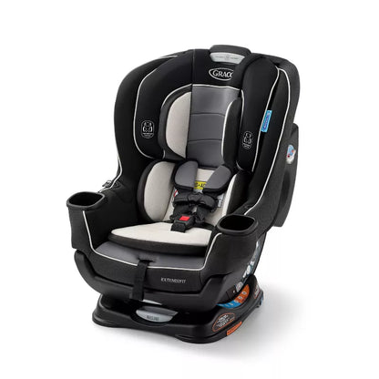 Infant car seat in black and grey, designed for safety and comfort during travel.