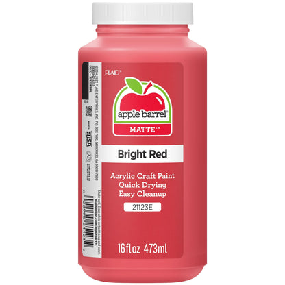 Red paint bottle with label on a white background