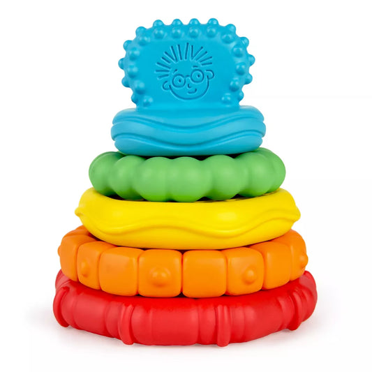 Stack of colorful silicone teething rings on a white background