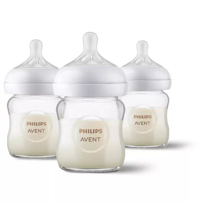 Three baby bottles on a white background