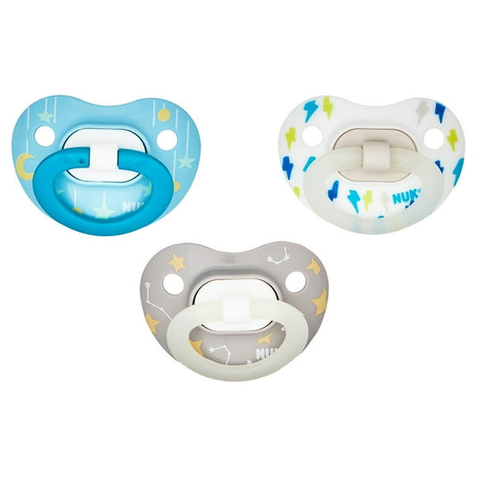 Three baby pacifiers in blue, gray, and white on a white background