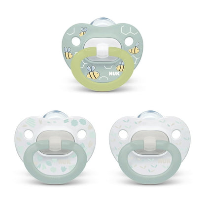 Three baby pacifiers with a light green and white design on a white background