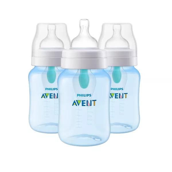 Three blue baby bottles with white caps on a white background