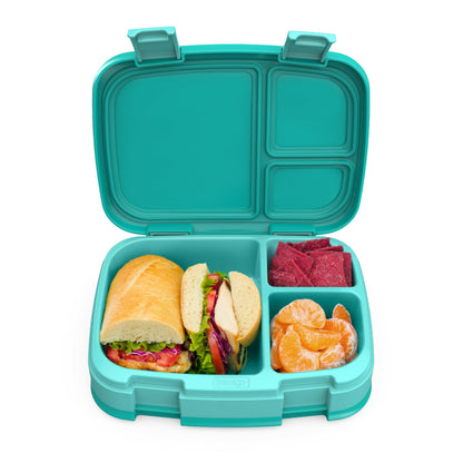 Turquoise bento lunch box with a sandwich, fruit, and meat slices on a white background
