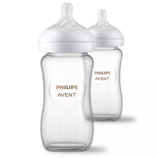 Two baby bottles on a white background