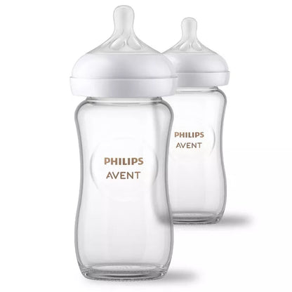 Two baby bottles on a white background