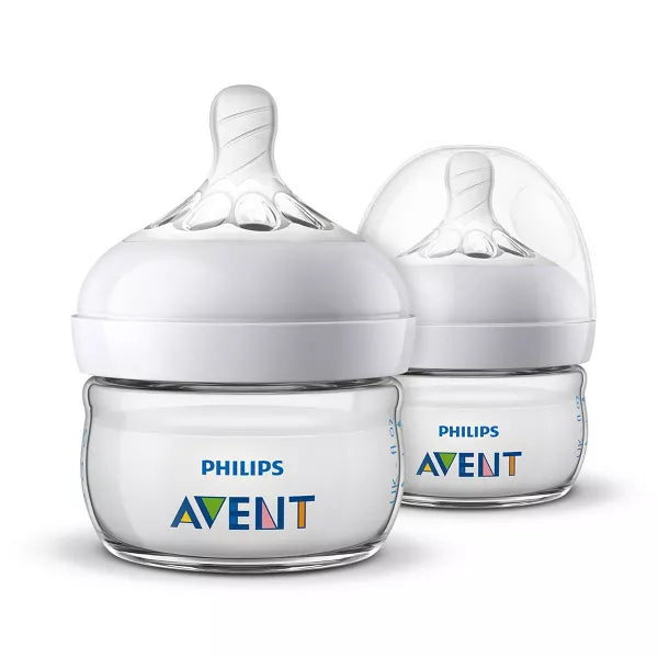 Two baby bottles on a white background