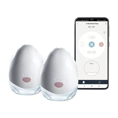 Two breast pumps and a smartphone displaying a pumping app on a white background