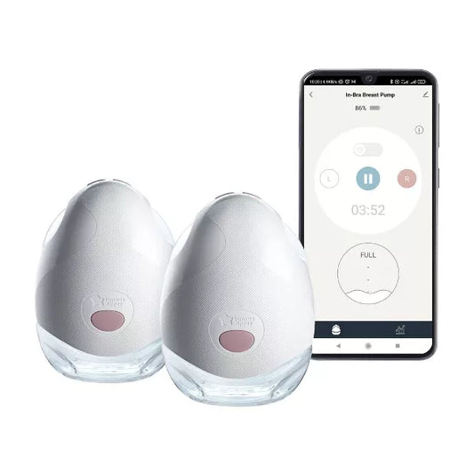 Two breast pumps and a smartphone displaying a pumping app on a white background