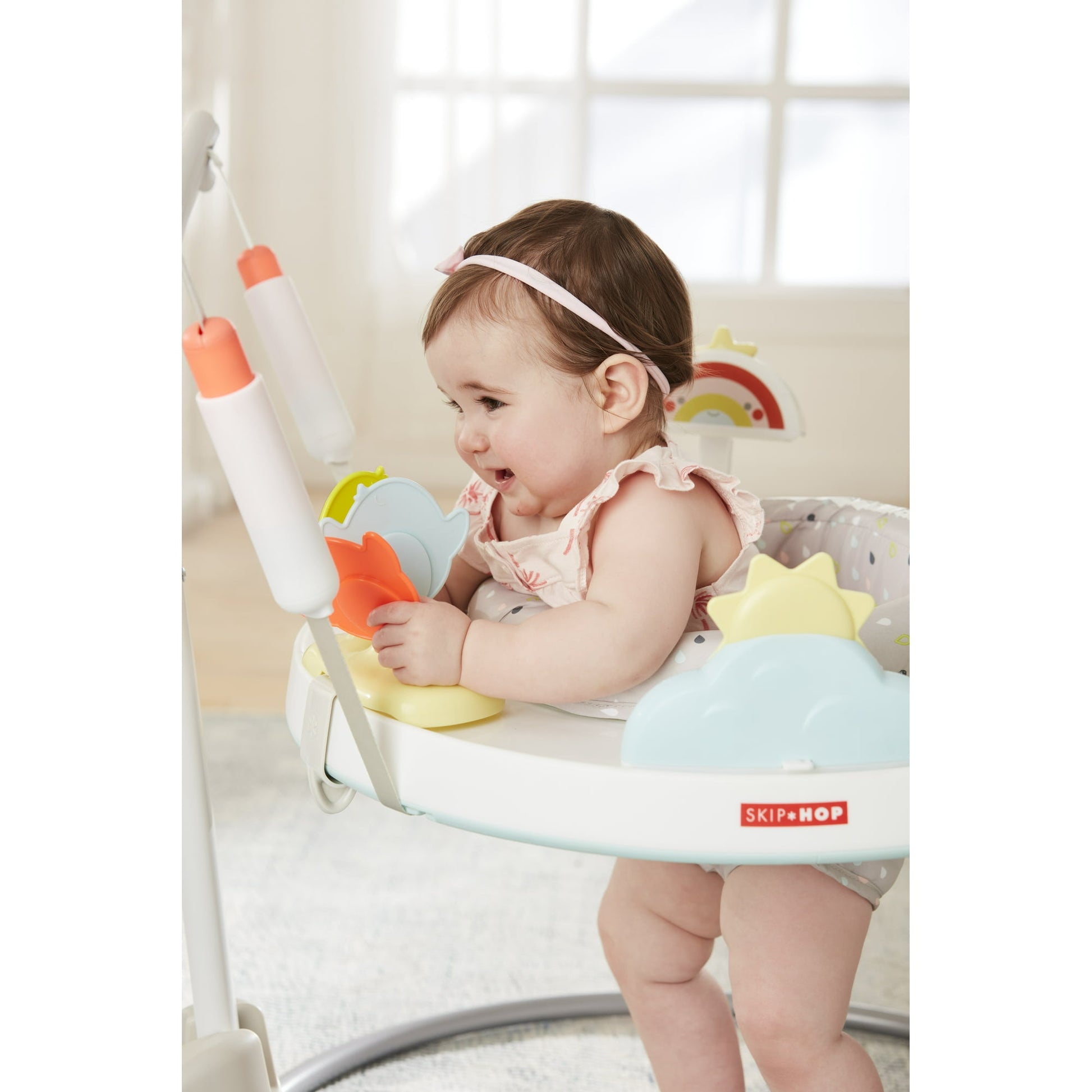 Image displaying a baby in a baby activity jumper