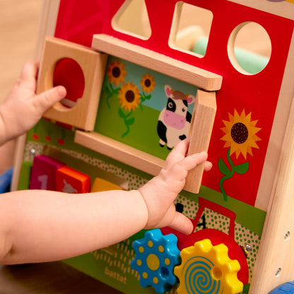Image displaying a baby playing with a baby activity walker