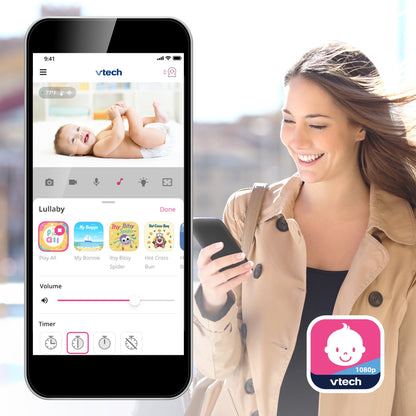 Woman viewing a smartphone app displaying a baby monitor feed of an infant, showing lullaby controls