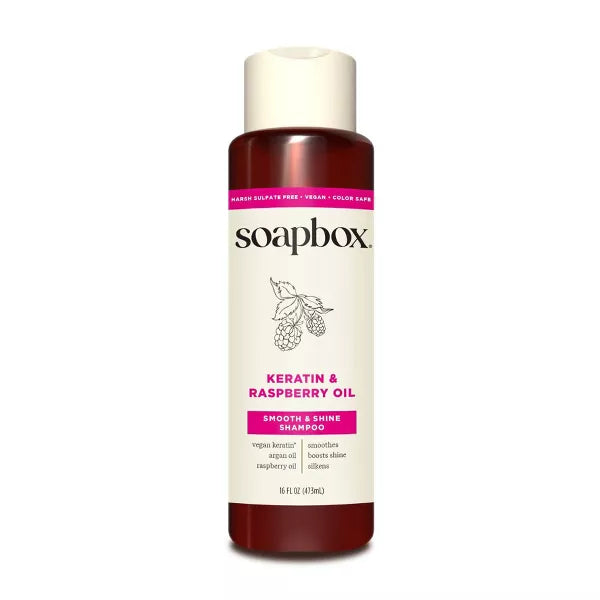 shampoo bottle with raspberry oil on a white background