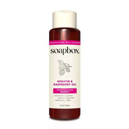 shampoo bottle with raspberry oil on a white background